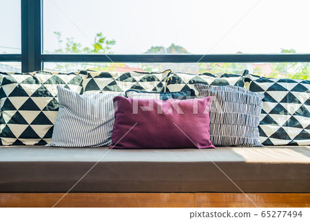 Comfortable pillow on sofa decoration in living room 65277494