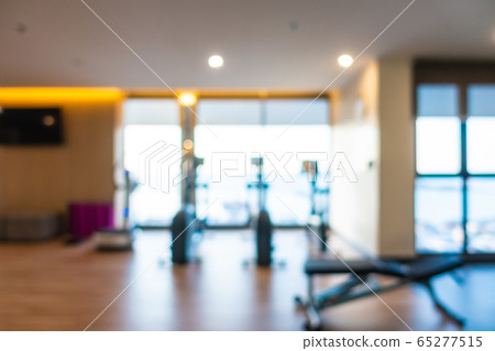 Abstract blur gym room interior with fitness equipment Abstract blur gym room interior with fitness equipment 65277515