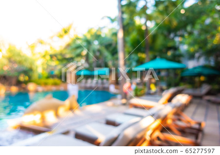 Abstract blur outdoor swimming pool in hotel resort 65277597