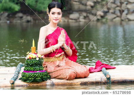 Portrait young woman wearing traditional thai red Portrait young woman wearing traditional thai red 65278698