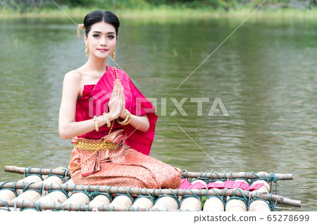 Portrait young woman wearing traditional thai red Portrait young woman wearing traditional thai red 65278699
