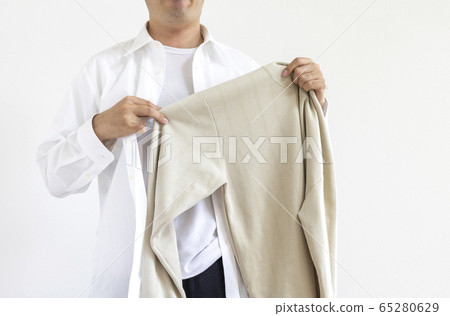 Men changing from suits to plain clothes 65280629