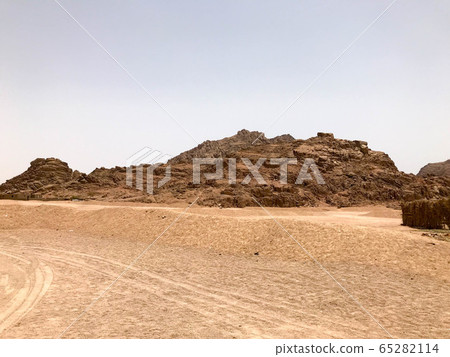 A large high stone sandy mountain A large high stone sandy mountain 65282114
