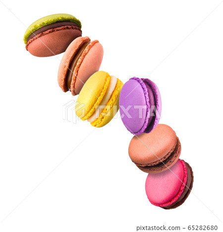 Set of flying french colorful macaroons isolated on white background 65282680