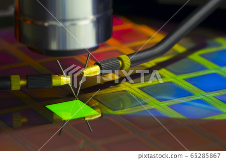 Close up of examining a sample of OLED display Close up of examining a sample of OLED display 65285867