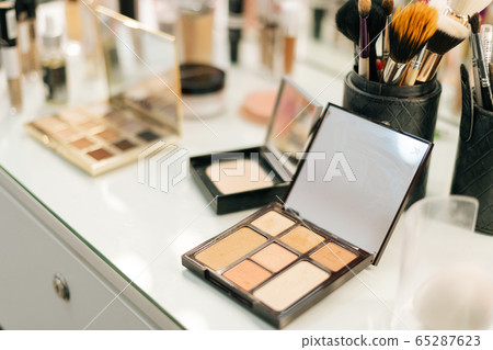 Close-up of professional powder box on woman table near mirror, no people.  65287623