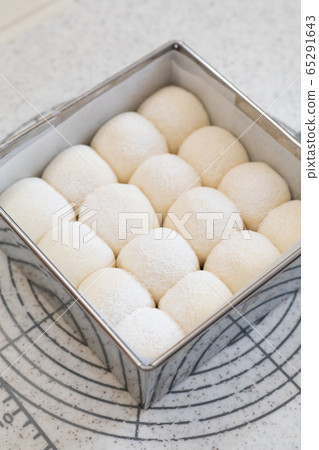 Bread made at home, chopped white bread, dough filled in a mold before baking in the oven 65291643