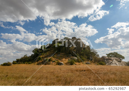 A giant rock in the endless plains of Serengeti, Tanzania A giant rock in the endless plains of Serengeti, Tanzania 65292987
