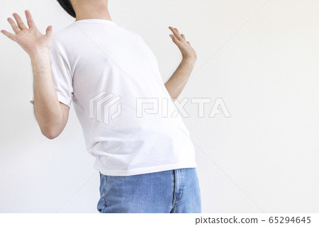 Surprised man raising his hands Surprised man raising his hands 65294645