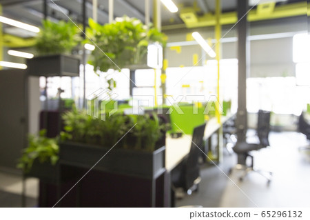 Blurred office space interior with green plant corner for relaxing 65296132