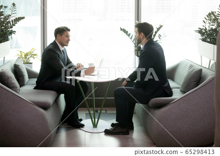 HR manager communicates with applicant during job interview in office HR manager communicates with applicant during job interview in office 65298413