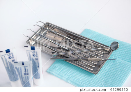 Group of dental tools and accessories. Isolated. 65299350