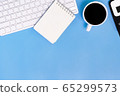 flat lay Office desk table of modern workplace with laptop on blue table, top view laptop background and copy space on black background 65299573