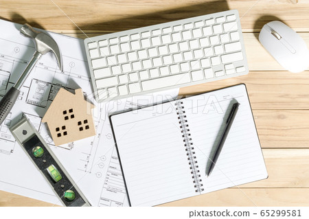 Architect workplace top view. Architectural project, blueprints, blueprint rolls on table. Construction background. Engineering tools. Copy space 65299581