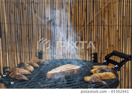 grilled tuna steak with baked potatoes grilled tuna steak with baked potatoes 65302841