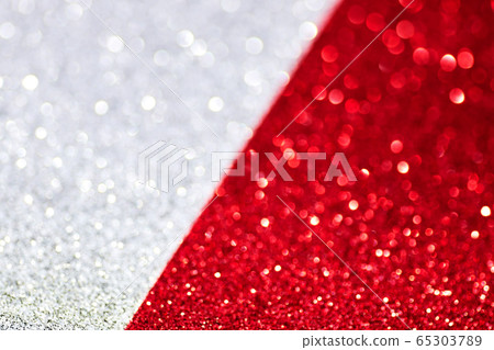 Silver and red defocused glitter backround. Silver and red defocused glitter backround. 65303789