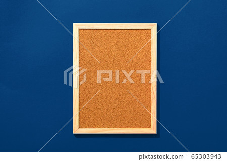 Empty coark board on red background Empty coark board on red background 65303943