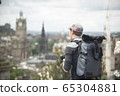 Photographer shooting buildings of Edinburgh 65304881