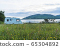 Caravan in a lake 65304892