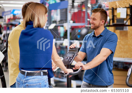 pleasant consultant help buyers in sportswear shop pleasant consultant help buyers in sportswear shop 65305510