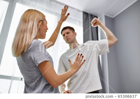 domestic violence, man raises his hand to wife 65306637