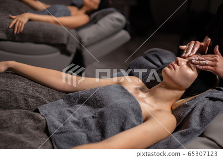 beautiful women get skin treatment beautiful women get skin treatment 65307123