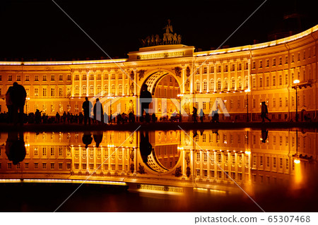 Silhouette of people with reflection in the puddle 65307468