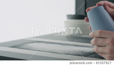 man hands check bottom of blue ceramic glass man hands check bottom of blue ceramic glass 65307927