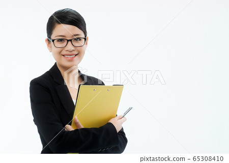 Smiling woman in a black jacket with glasses explaining with a ballpoint pen and clipboard 04 Smiling woman in a black jacket with glasses explaining with a ballpoint pen and clipboard 04 65308410