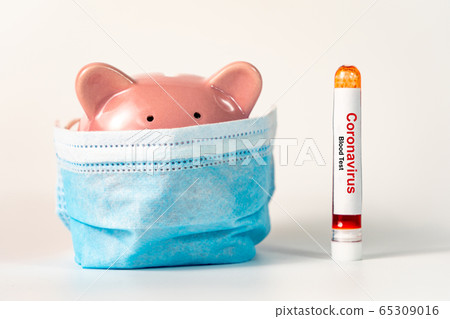 Piggybank wearing medical mask and Coronavirus blood test sample 65309016
