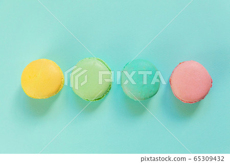 Colorful macaron on blue background Colorful macaron on blue background 65309432