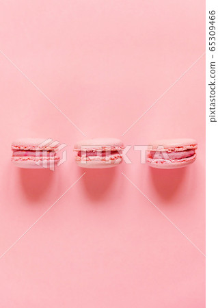 Pink macaron on pink background 65309466