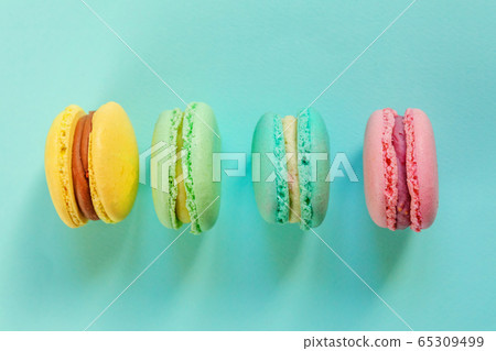 Colorful macaron on blue background 65309499
