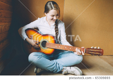 Stay Home Stay Safe. Young woman sitting in room Stay Home Stay Safe. Young woman sitting in room 65309893