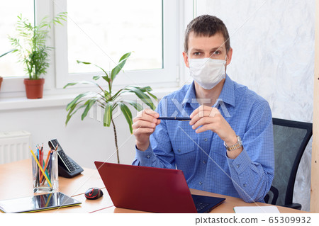 Portrait of a businessman with a medical mask on Portrait of a businessman with a medical mask on 65309932