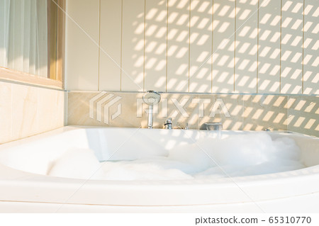 White bathtub and jacuzzi decoration interior White bathtub and jacuzzi decoration interior 65310770