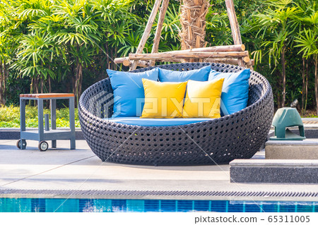 Outdoor patio in the garden with sofa chair and pillow decoration Outdoor patio in the garden with sofa chair and pillow decoration 65311005