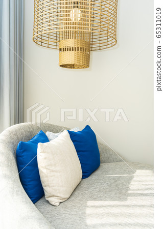 Comfortable pillow on sofa chair 65311019