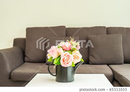 Vase flower on table with pillow and sofa decoration interior Vase flower on table with pillow and sofa decoration interior 65311033
