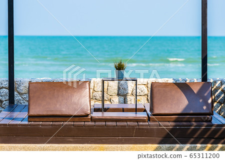 Pillow on sofa bed with lounge around beach ocean sea and blue sky Pillow on sofa bed with lounge around beach ocean sea and blue sky 65311200