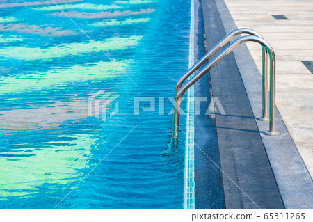 Stair around outdoor swimming pool in hotel resort 65311265