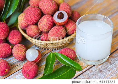 Fresh lychee drink and slice peeled with green Fresh lychee drink and slice peeled with green 65311821