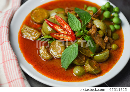 Thai food curry soup on white plate - red curry 65311825