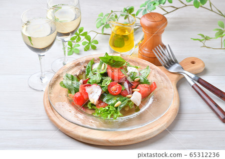 Salad carpaccio of basil (herb) and tomato, octopus and scallop. Italian and seafood salad. 65312236