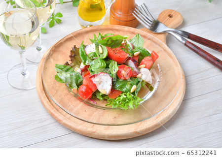 Salad carpaccio of basil (herb) and tomato, octopus and scallop. Italian and seafood salad. 65312241