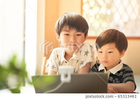 Boys having a video chat 65313461