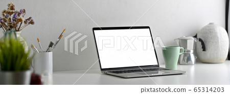 Side view of modern office desk with blank screen Side view of modern office desk with blank screen 65314203