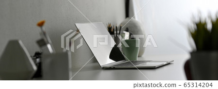 Side view of modern office desk with laptop, Side view of modern office desk with laptop, 65314204