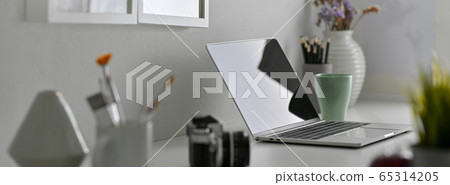 Side view of designer office desk with laptop, Side view of designer office desk with laptop, 65314205