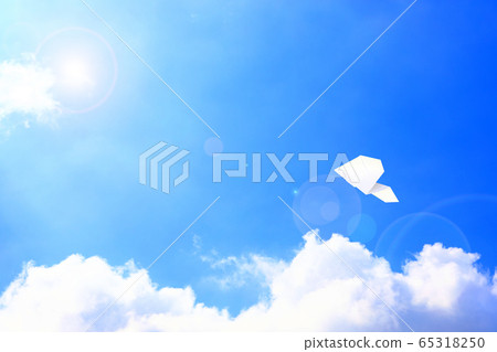 Paper airplane flying in the sky 65318250